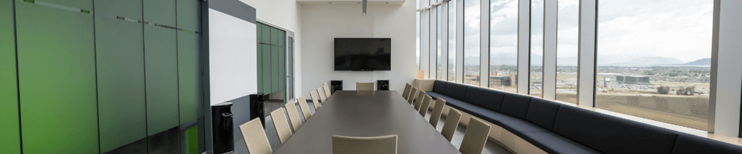 Rectangular brown wooden table with chair lot inside building